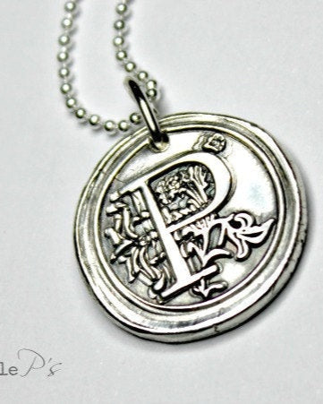 A sterling silver monogram wax seal charm pendant with the letter 'P' on it, attached to an 18 inch sterling silver bead chain.
