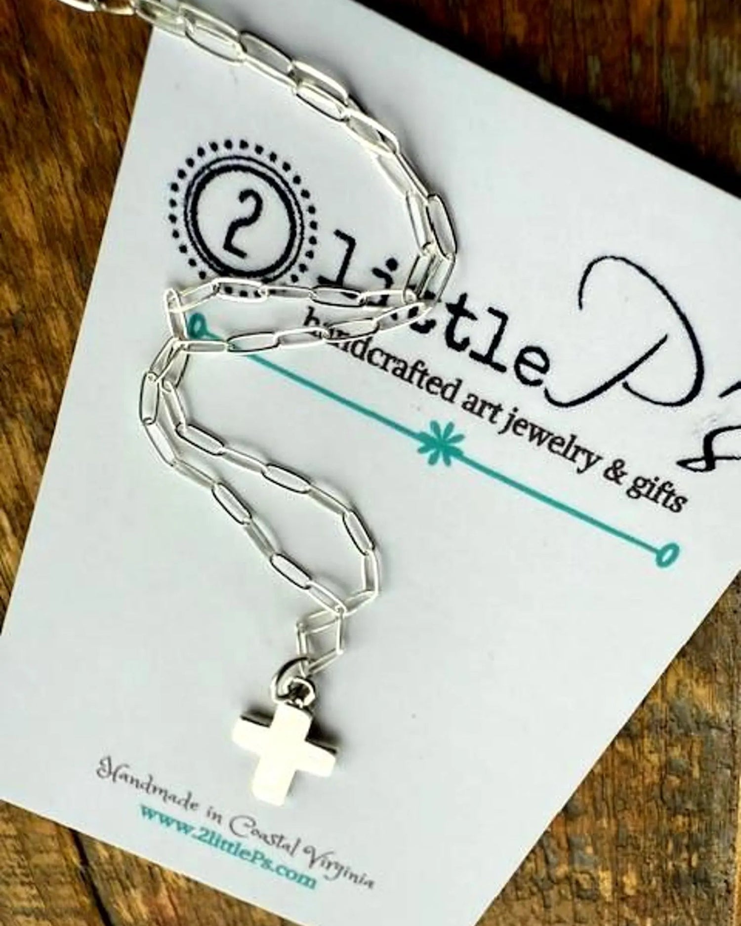 Sterling Silver paper clip chain necklace with a cross pendant on a 'Little P's' branded card.